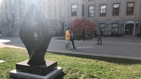 A granite statue of Mother Earth by Indigenous artist David General is installed outside Tabaret Hall at the University of Ottawa. Mother Earth