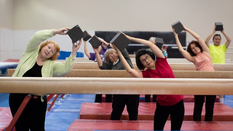 Gymnastics for seniors promotes balance and flexibility instead of back  flips