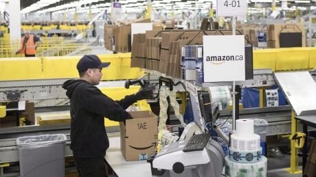 An employee works at the the Amazon fulfillment centre in Brampton, ON. The company has close to 200 centres around the world. Amazon Fulfillment Center 20181217