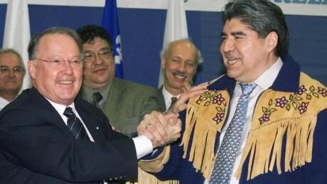 Former premier Bernard Landry and former grand chief of the Grand Council of the Crees, Ted Moses, shake hands in 2002 after signing the Paix des Braves, an agreement that marked a turning point in relations between Quebec and the Cree Nation. Bernard Landry Ted Moses
