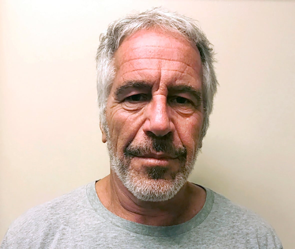 Mug shot of greying man in grey T-shirt.