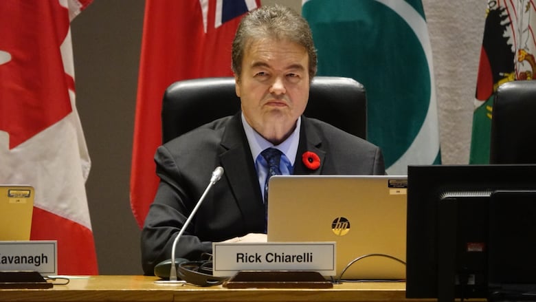 A man sitting on a council.