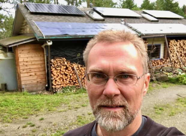 David Elderton with solar panels