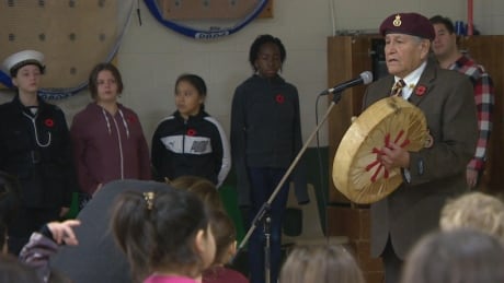 Wanbdi Wakita is a Dakota elder. Wakita is a residential school survivor who joined the military after residential school. Here he is sharing the Dakota Flag song on Aboriginal Veterans day. Wanbdi Wakita