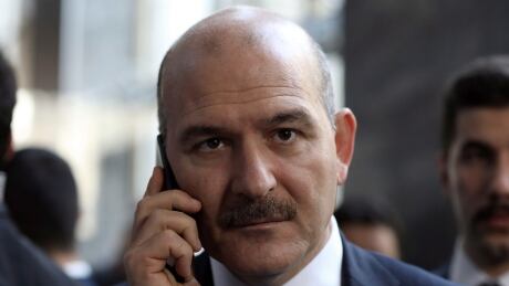 FILE - In this Wednesday, Nov. 5, 2019 file photo, Turkey's Interior Minister Suleyman Soylu speaks on the phone in Ankara, Turkey. Soylu says Turkey will start sending back Islamic State group members to their countries of origin next week. Soylu made the comments on Friday, Nov. 8 days after Turkey insisted that members of the extremist group held by Turkey would be returned regardless of countries revoking their citizenship. (AP Photo/Burhan Ozbilici, File) Turkey Syria