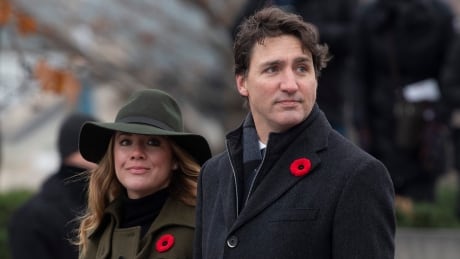 Sophie Gregoire and Prime Minister Justin Trudeau wait for veterans and soldiers to pass following a Remembrance day ceremony at the National War Memorial Monday November 11, 2019 in Ottawa. Remembrance Day 20191111