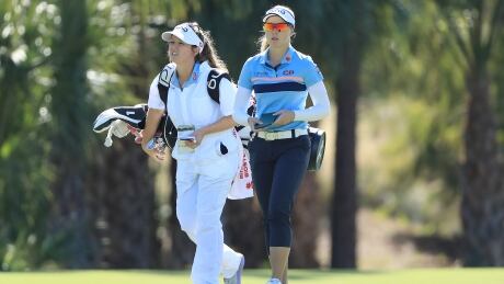 Brooke Henderson is seen with her caddie during the first round of the CME Group Tour Championship on Thursday in Naples, Fla. 1189168126