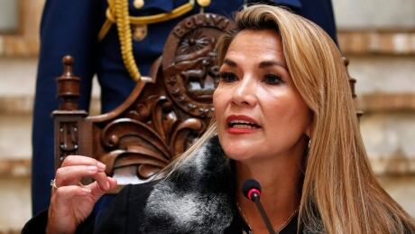 Bolivia's interim President Jeanine Anez looks up during a press conference in La Paz, Bolivia, Friday, Nov. 15, 2019. Anez, a Senate deputy leader who claimed the interim presidency, is moving to establish authority in the turbulent country. She announced on Thursday that Morales, who resigned Sunday after allegations of election fraud, could not participate in elections again and criticized Mexico’s government for allowing Morales to rally support from Mexico City. Bolivia Elections