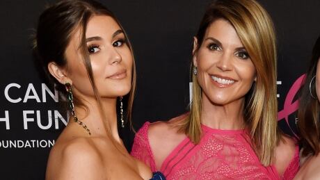 Actress Lori Loughlin, right, poses with her daughter Olivia Jade Giannulli in February 2019. Social media star Giannulli posted to YouTube video channel on Dec. 1, for first time since the arrest of her parents in the college admissions scandal. (Photo by Chris Pizzello/Invision/AP, File) College Admissions Bribery Olivia Jade