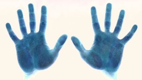 The Winnipeg Police Service is installing biometric hand scanners at its downtown headquarters. hands
