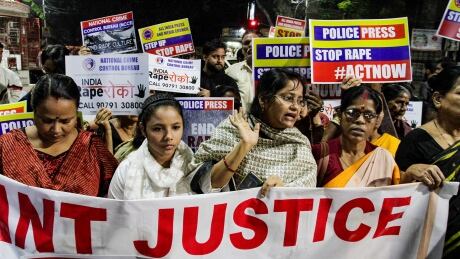 Indians demanding justice in the case of a veterinarian who was gang-raped and killed last week, walk with placards during a protest in Kolkata, India, Wednesday, Dec. 4, 2019. The burned body of the 27-year-old woman was found Thursday morning by a passer-by in an underpass in the southern city of Hyderabad after she went missing the previous night. (AP Photo/Bikas Das) India Gang Rape