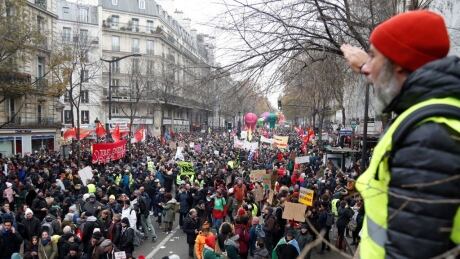 People take part in a demonstration against the pension overhauls, in Paris, on December 5, 2019 as part of a nationwide strike. - Trains cancelled, schools closed: France scrambled to make contingency plans on for a huge strike against pension overhauls that poses one of the biggest challenges yet to French President's sweeping reform drive. (Photo by Zakaria ABDELKAFI / AFP) (Photo by ZAKARIA ABDELKAFI/AFP via Getty Images) 1186561685