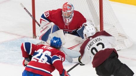Colorado Avalanche's Gabriel Landeskog scores against Montreal Canadiens goaltender Cayden Primeau as Canadiens' Jeff Petry defends during first period NHL hockey action in Montreal, Thursday. The Avs went on to win, 3-2. HKN Avalanche Canadiens 20191205