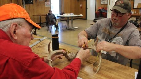 Former president of the Saskatoon Wildlife Federation, Al Leggott, left, and current Wildlife Federation president Howard Closson work to score a rack at the "Scoring Day" event held at the Saskatoon Wildlife Federation on Dec. 8, 2019.
Scorers