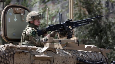 U.S. Resolute Support (RS) forces guard at the site of a car bomb explosion in Kabul on Sept. 5. The U.S. has lost 2,400 men and women since the deployment to Afghanistan in 2001, with thousands more wounded.
Afghanistan
