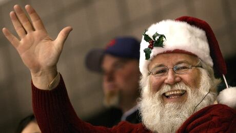Just 14 more sleeps until this guy (well, not really this guy - this guy is an oddly dressed fan at an NHL game) starts climbing down chimneys. 72873449