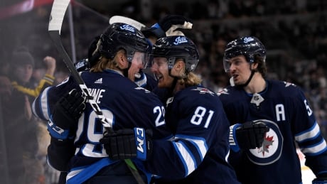 Jets players celebrate forward Patrik Laine's goal as Winnipeg beat the Detroit Red Wings 5-1 on Tuesday. HKN Red Wings Jets 20191210