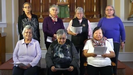 A screenshot from a video of Elders singing Christmas carols in Secwepemctsin at a church in Williams Lake, B.C. in December 2019. Top row, from left to right, Jean William, Clara Camille, Cecilia De Rose and Darlene Louie. Bottom row, from left to right, Antoinette Archie, Elsie Archie and Bridget Dan. Secwepemc Elders sing Christmas carols