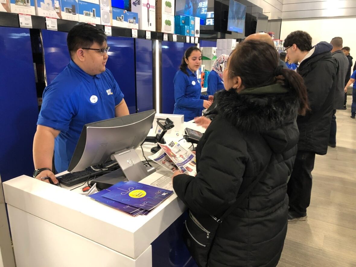 Early bird Boxing Day shoppers in Winnipeg line up calmly for deals