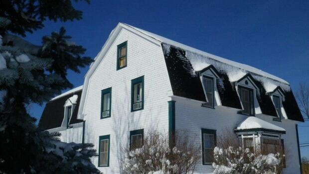 Is the historical Doucet Hennessy House in Bathurst haunted? A visit from Canadian Paranormal Expeditions investigators may determine if it is or not. A white house in the snow