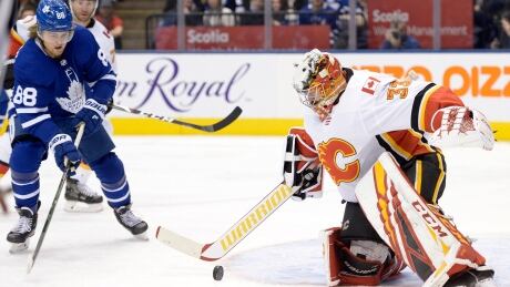 Calgary Flames goaltender David Rittich turns away Toronto Maple Leafs forward William Nylander for one of his 35 saves in a 2-1 victory on Thursday. HKN Flames Maple Leafs 20200116
