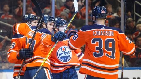 From left to right: Leon Draisaitl, Connor McDavid, Ryan Nugent-Hopkins and Alex Chiasson of the Oilers celebrate a goal during Edmonton's 7-3 victory over the Arizona Coyotes on Saturday.
Oilers-Coyotes-180120
