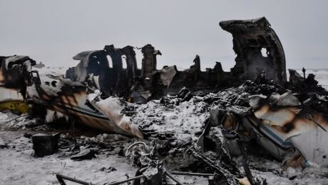 The wreckage of a U.S. military aircraft that crashed in Ghazni province, Afghanistan, is seen Monday. A U.S. military official said there were no indications so far it'd been brought down by enemy fire. Afghanistan Plane Crash