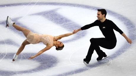 Canada's Kirsten Moore-Towers and Canada's Michael Marinaro, shown in this December 2019 file photo, lead the pairs competition after the short program on Thursday at the Four Continents event in Seoul. 1186754406