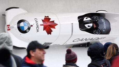 Canada's Justin Kripps and former CFL receiver Sam Giguere collected a bronze medal in Sunday's 2-man race at the season's final World Cup event in Sigulda, Latvia. kripps-justin-latvia-200216-1180