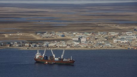 A cargo ship sits in the bay at Cambridge Bay, Nunavut, on Sept. 2, 2017. The federal government has announced it will support an international ban on the use of environmentally damaging heavy fuel oils in Arctic shipping. The announcement comes despite concerns that forcing shippers to use more expensive fuels will raise costs for northern families. Arctic Fuel Ban 20200218