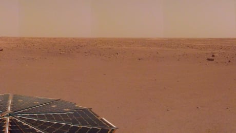 NASA's InSight spacecraft captured this panorama of its landing site on Dec. 9, 2018, the 14th Martian day, or sol, of its mission. The 290-degree perspective surveys the rim of the degraded crater InSight landed in, nicknamed "Homestead Hollow."
The panorama is made up of 30 individual images that were taken by the spacecraft's Instrument Deployment Arm camera, located on its robotic arm. Mars InSight lander