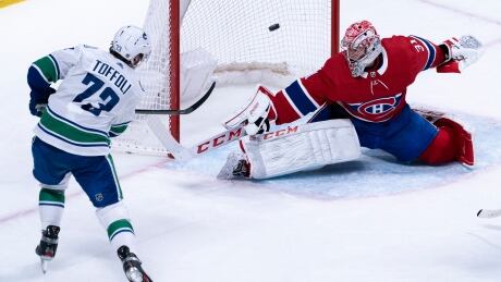 Vancouver forward Tyler Toffoli scores on Montreal goaltender Carey Price in overtime during the Canucks' 4-3 victory over the Canadiens. HKN Canucks Canadiens 20200225