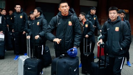 Players of the Chinese Super League team Wuhan Zall arrive at the Atocha train station in Madrid, Spain, Saturday, Feb. 29, 2020. The Chinese first-division soccer club from the city of Wuhan enters its second month in Spain without knowing when it will be able to return home. Wuhan-Soccer