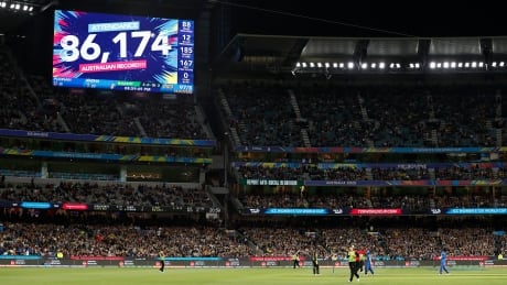 The scoreboard displays the crowd attendance during the ICC Women's T20 Cricket World Cup Final match between India and Australia at the Melbourne Cricket Ground on Sunday. 1211144179