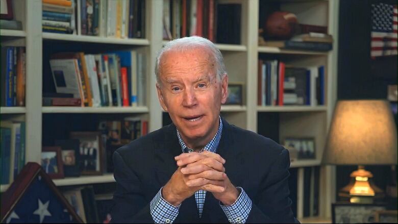 With presidential campaign events sidelined by the pandemic, Democratic contender Joe Biden has changed his routine, speaking to media via a video feed from his house. He's been tentative in criticizing the president.(Biden for President via The Associated Press)