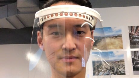 Leon Ng, CEO of LNG Studios, wears the medical face shields his company's 3D printers have been making for local hospitals in Metro Vancouver. FACE SHIELD 3D PRINTER