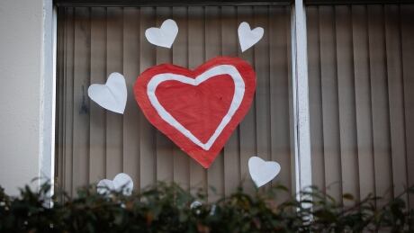 A heart pasted on the window in Vancouver’s West End earlier this week, showing support for the community and healthcare workers. COVID-19 7PM CHEER