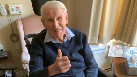 Reuben Huva, 99, gives a thumbs up after being declared free of COVID-19 on Wednesday. Reuben Huva