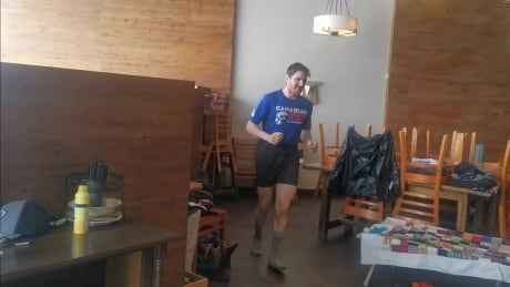 Matthew Shepard runs in socks around the Tall Timber Coffee Corporation during the Quarantine Backyard Ultra. Matthew Shepard
