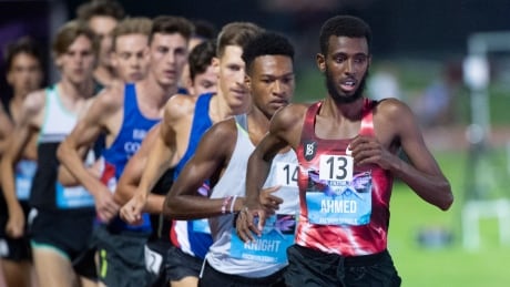 Canada's Mohammed Ahmed leads the 5,000-metre pack at the Canadian track championships in July. On Tuesday, the International Olympic Committee clarified new qualification guidelines for the Tokyo Games, allowing already-qualified athletes to keep their spots. ahmed-mohammed-040720
