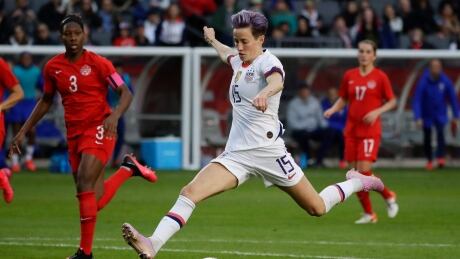U.S. forward Megan Rapinoe scores a goal in a February match against Canada. On Wednesday, the women's soccer team's discrimination case was delayed due to the coronavirus pandemic. rapinoe-megan-040820
