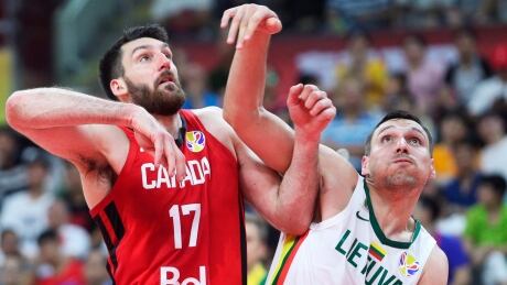 Owen Klassen, left, is seen competing for Canada at the FIBA basketball World Cup last September. Canada did not secure an Olympic berth at that tournament but was sceduled to host a last-chance qualifier in Victoria in June. BKO World Cup Canada 20190906