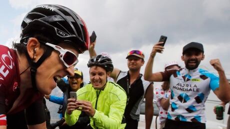 Britain's Geraint Thomas is cheered by fans during the 2019 Tour de France. On Tuesday, race organizers postponed the events due to the global coronavirus outbreak. tour-de-france-041420