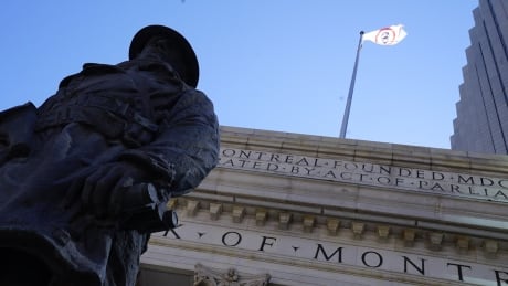The flag of the Manitoba Metis Federation flies above the Bank of Montreal at Portage and Main on Tuesday, the 150th anniversary of Manitoba. Bank of Montreal Building in Winnipeg new Manitoba Métis Federat