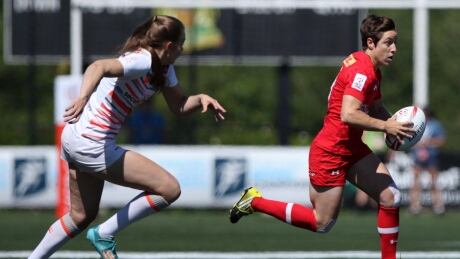 Team Canada's Ghislaine Landry, right, seen during a match against Team England in 2017. Rugby Canada has cut player payments effective May 1 citing financial difficulty tied to the COVID-19 pandemic. RGU Sevens Landry 20200501