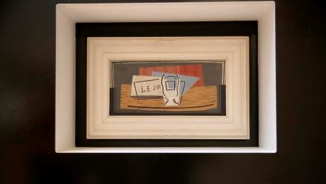The painting "Nature morte" by Picasso hangs on a wall at Christie's auction house, Tuesday, May 19, 2020 in Paris. After an eight-week delay caused by France's COVID-19 lockdown, the Christie's auction house in Paris is hosting a raffle draw Wednesday for "Nature Morte," an oil on canvas that Picasso painted in 1921.Raffle organizers say they have already raised 5 million euros ($5.4 million) by selling 50,000 tickets online for 100 euros ($109) each. Their hoped-for sales target was 200,000 tickets but the coronavirus crisis complicated the task. France Picasso Raffle