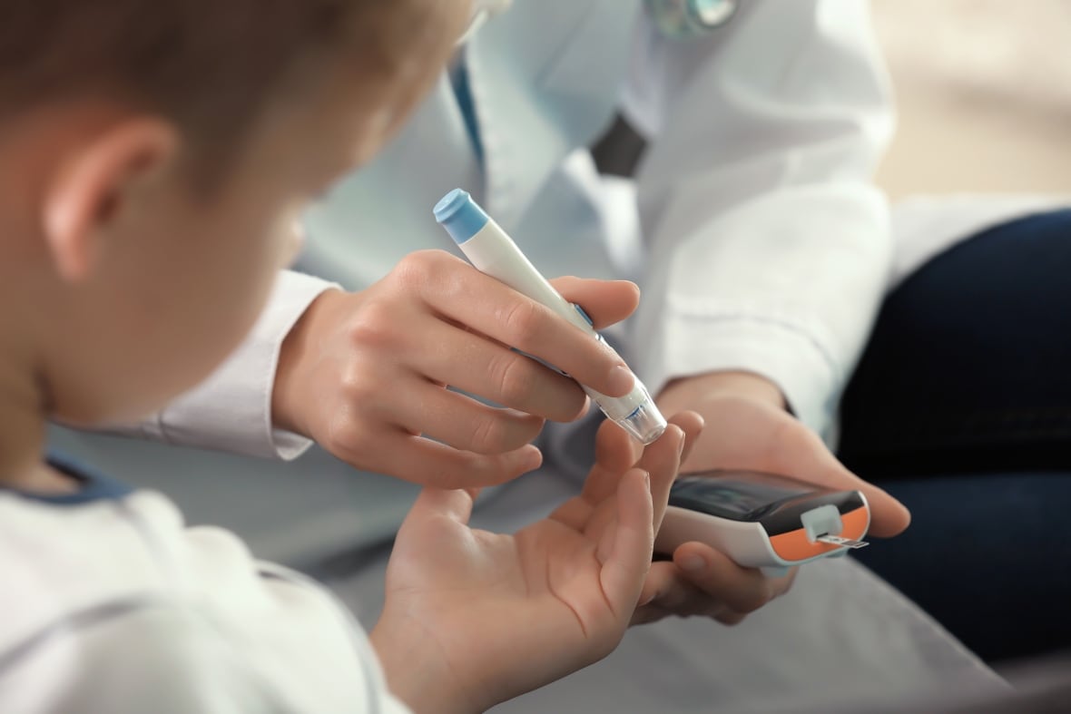 checking a patients blood sugar