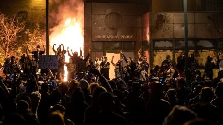 Protesters gesture after the Minneapolis police 3rd Precinct building was set on fire Thursday night, during demonstrations over the Monday death of George Floyd in Minneapolis police custody. (Carlos Gonzalez/Star Tribune via AP) Minneapolis Police Death