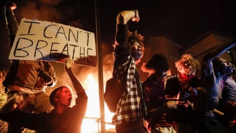 Protestors gather outside of a burning Minneapolis 3rd Police Precinct, which was eventually breached by some demonstators. It was the third night of protests over the death of George Floyd, a black man who died in police custody Monday. APTOPIX Minneapolis Police Death