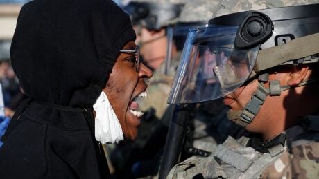 A protester yells at a member of the Minnesota National Guard Friday, May 29, 2020, in Minneapolis. Protests continued following the death of George Floyd, who died after being restrained by Minneapolis police officers on Memorial Day. APTOPIX Minneapolis Police Death